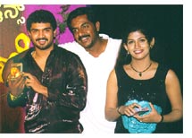 Director Yogaraj Bhat with hero Manoj and heroine Radhika