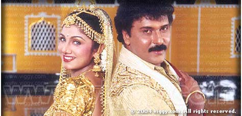 Rambha and Ravichandran in film Sahukara